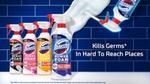 An ad showing a row of four Domestos Power Foam bottles on a white counter in front of a blue-tiled wall. Next to them is an upturned bottle with Power Foam being sprayed from the bottle onto the wall.