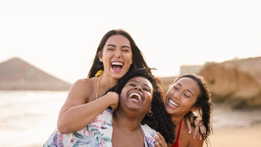 Three people on a beach