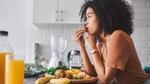 A woman eating fruit